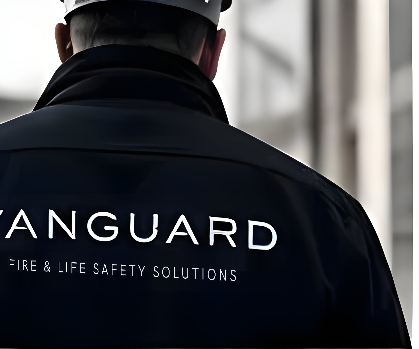 A Vanguard engineer in branded workwear on site