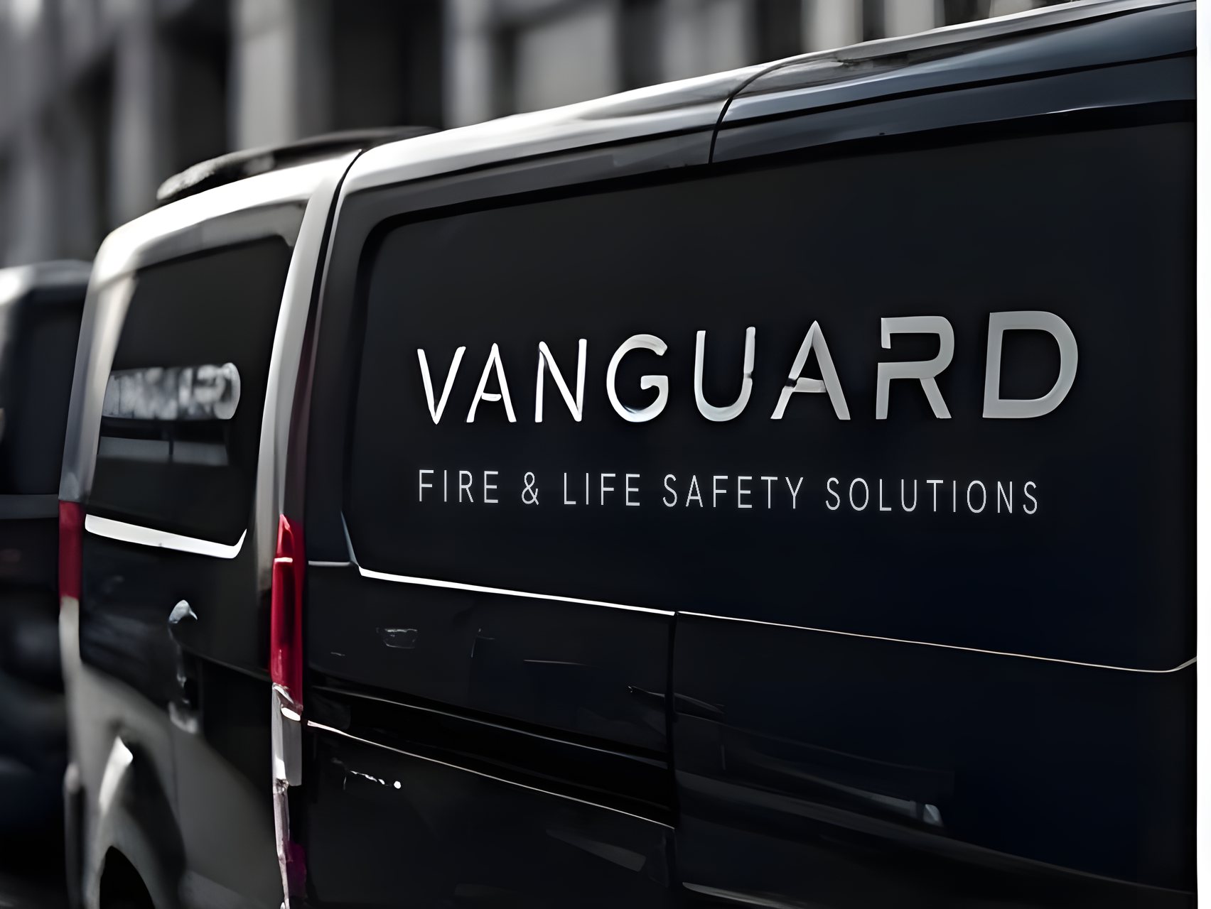 A Vanguard liveried van outside a building